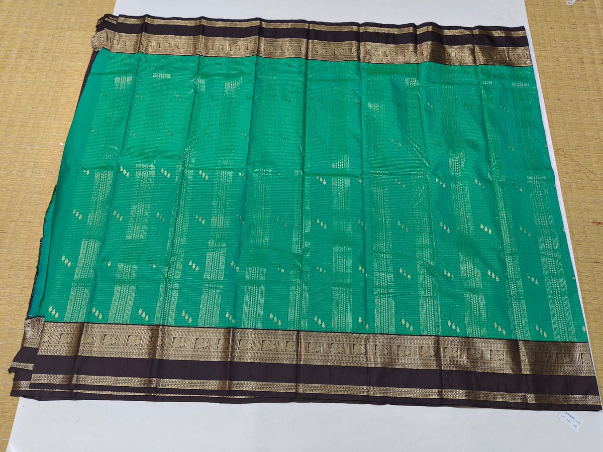Emerald green and brown gold border festive saree