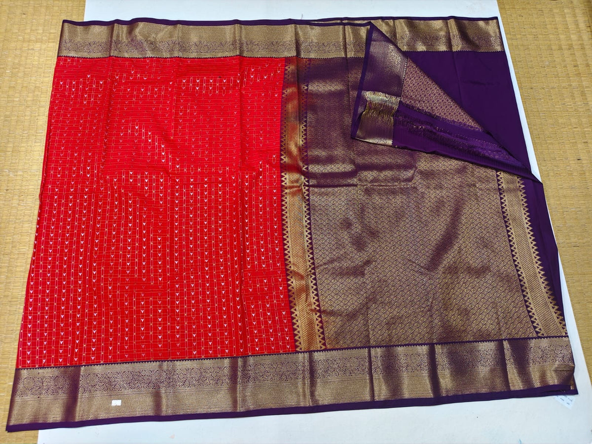 Red and purple Ikat-style semi-silk festive saree with gold border and pallu